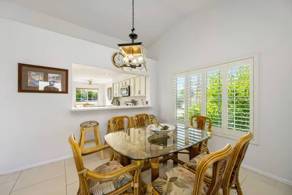 a view of a dining room with furniture window and outside view