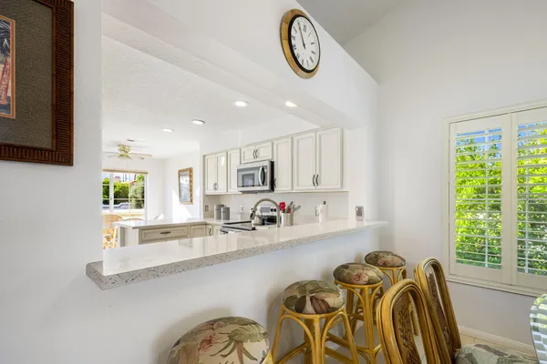 a view of a kitchen with furniture and a window