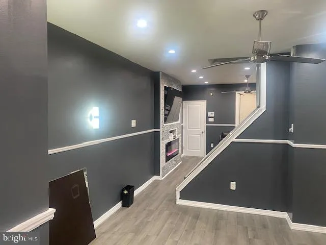 a view of a hallway with seating space