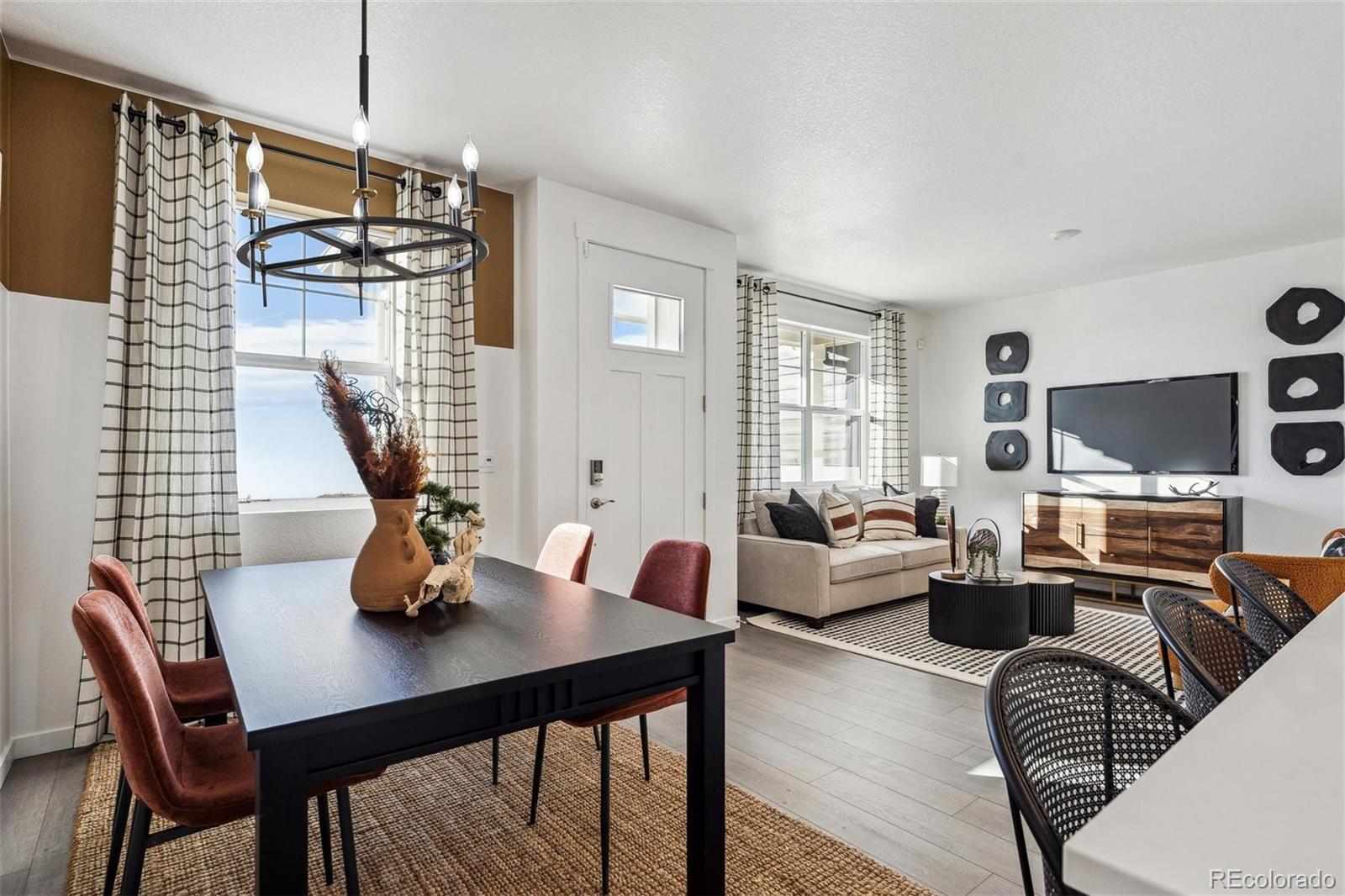 932 Logan Peak Way Berthoud, CO 80513 - Photo 13 of 34 a living room with furniture and a flat screen tv