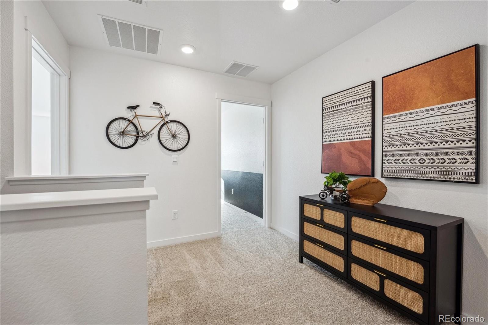 932 Logan Peak Way Berthoud, CO 80513 - Photo 15 of 34 a front view of a house with entryway and stairs