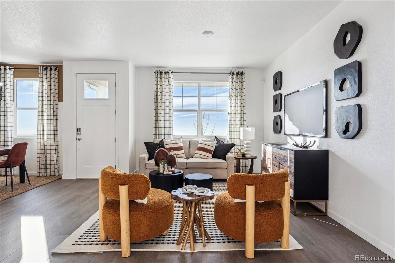 932 Logan Peak Way Berthoud, CO 80513 - Photo 2 of 34 a living room with fireplace furniture and a window