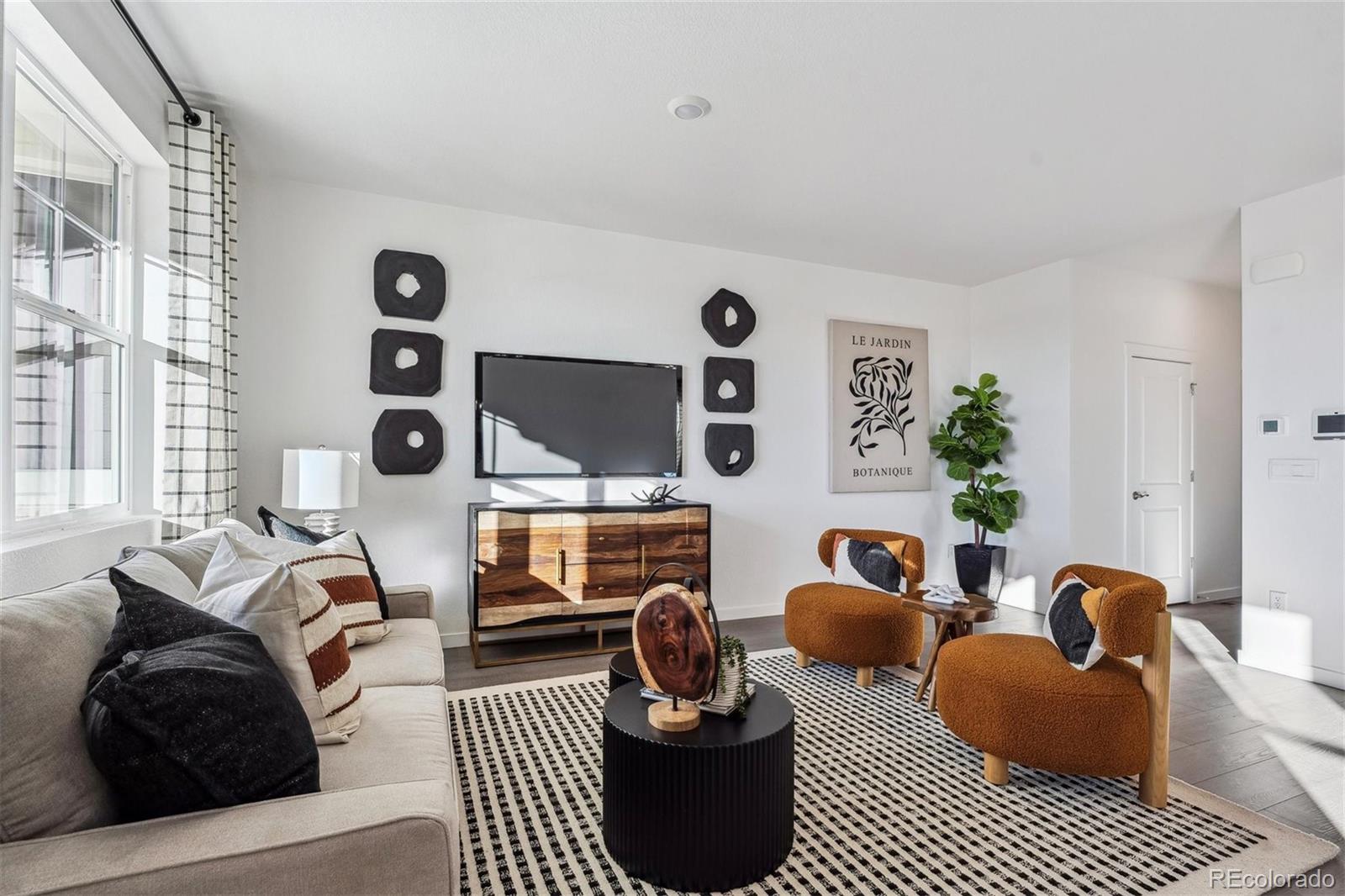 932 Logan Peak Way Berthoud, CO 80513 - Photo 4 of 34 a bedroom with furniture and a window