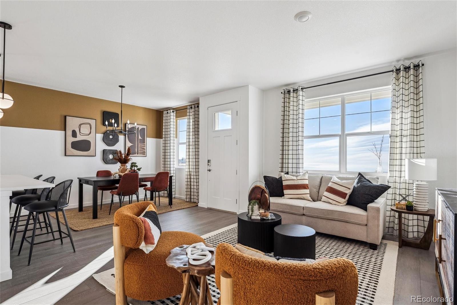 932 Logan Peak Way Berthoud, CO 80513 - Photo 5 of 34 a living room with furniture and a large window