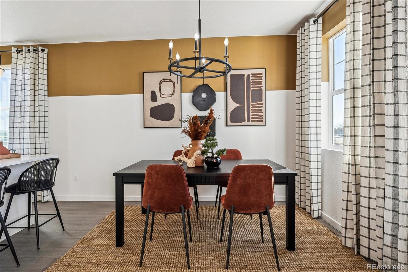 932 Logan Peak Way Berthoud, CO 80513 - Photo 9 of 34 a view of a dining room with furniture and chandelier