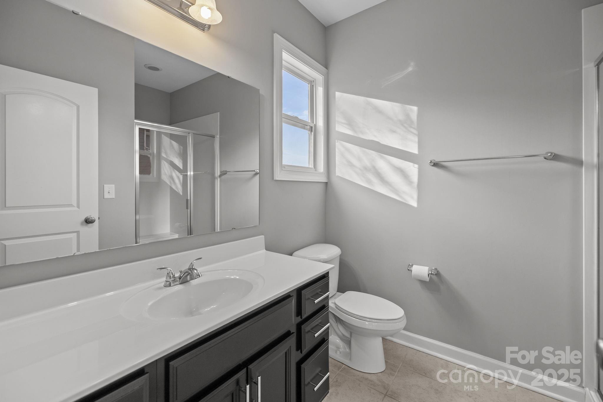 366 Hampton Trail Drive Fort Mill, SC 29708 - Photo 23 of 45 a bathroom with a toilet a sink and mirror