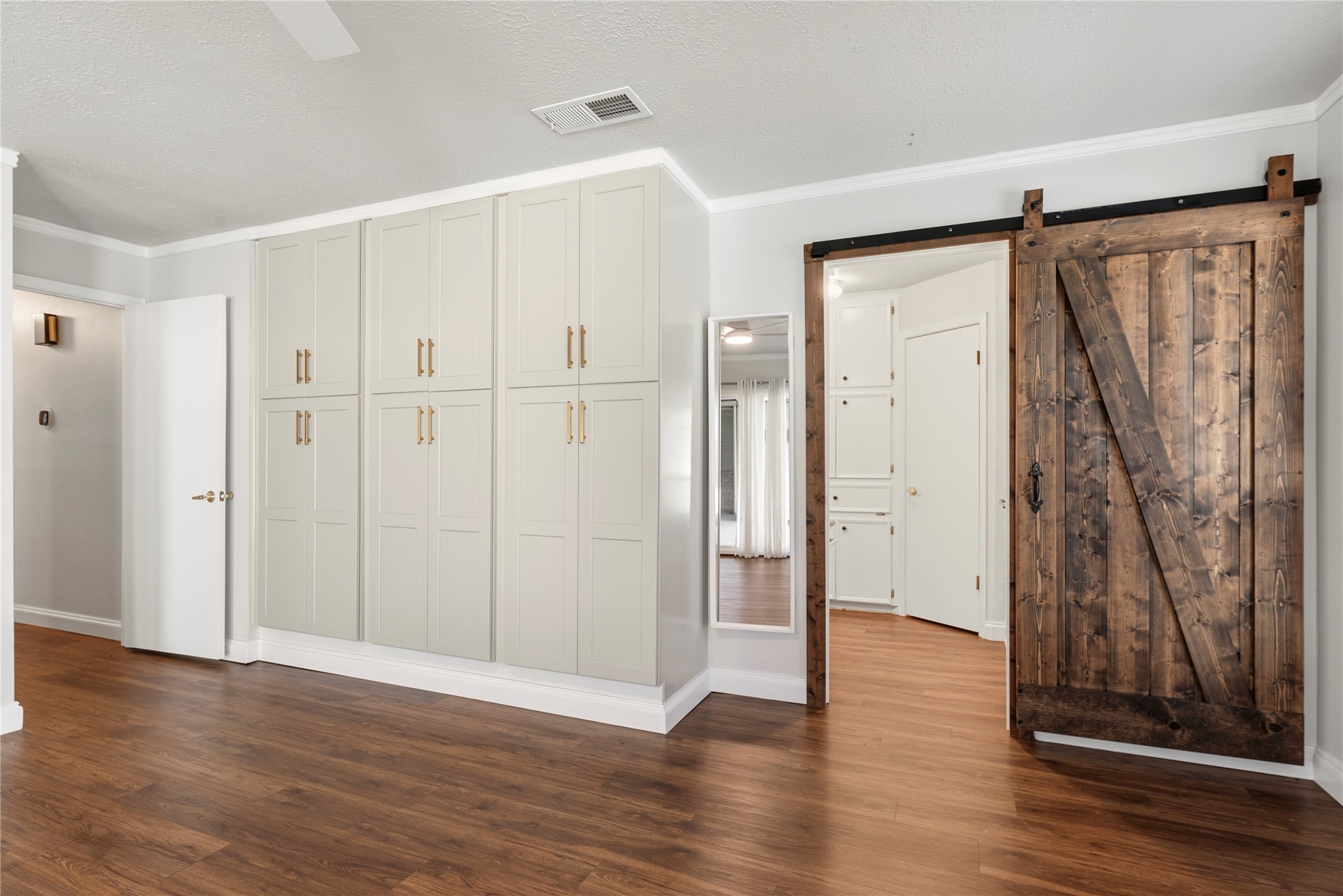 12802 Jarvis Road Cypress, TX 77429 - Photo 15 of 29 an empty room with wooden floor and a ceiling fan