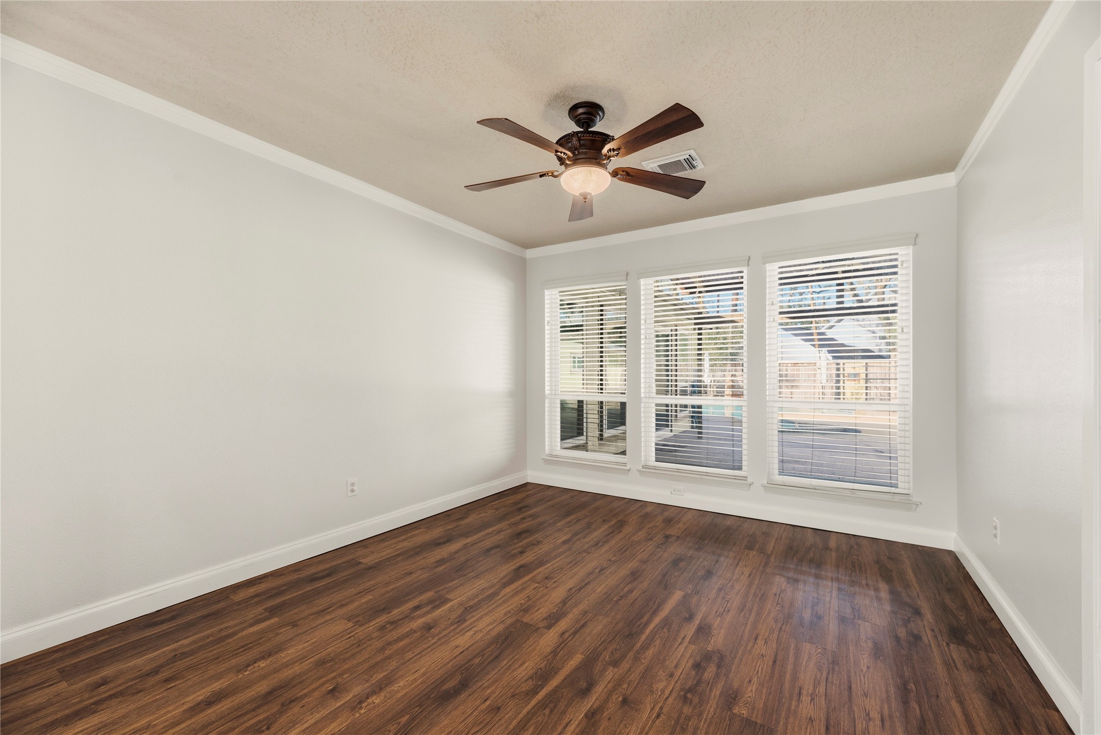 12802 Jarvis Road Cypress, TX 77429 - Photo 10 of 29 a view of empty room with wooden floor and fan
