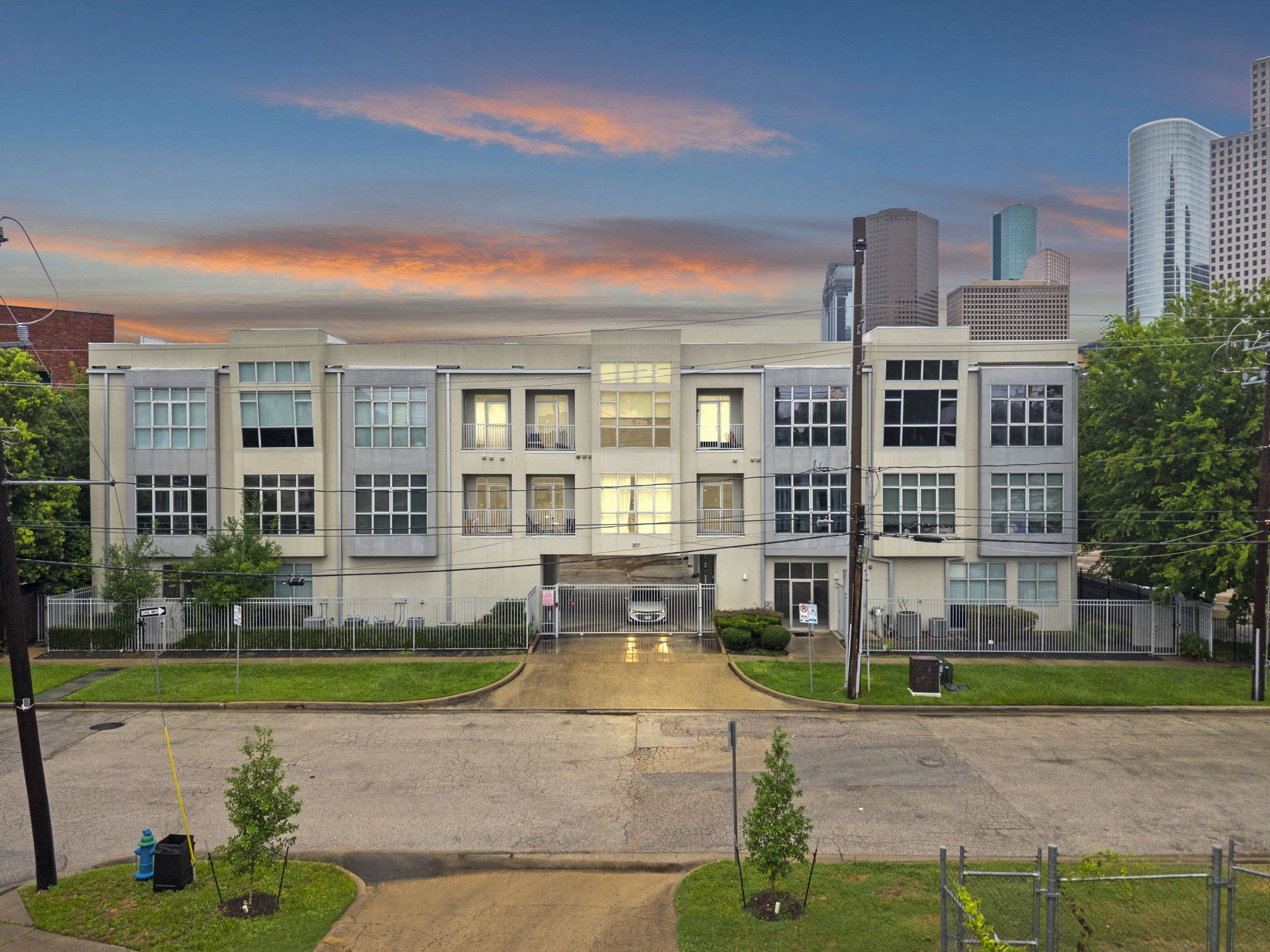 207 Pierce Street, Unit 209 Houston, TX 77002 - Photo 1 of 13 a view of a building with a garden