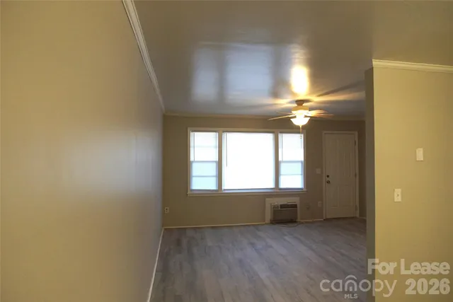 a view of an empty room and window