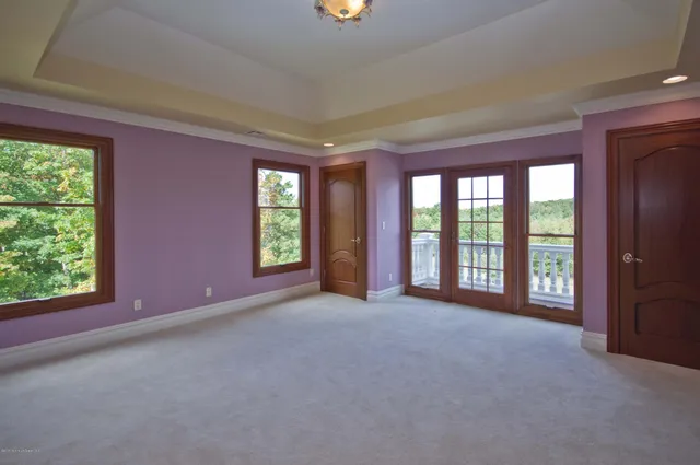 an empty room with windows and view