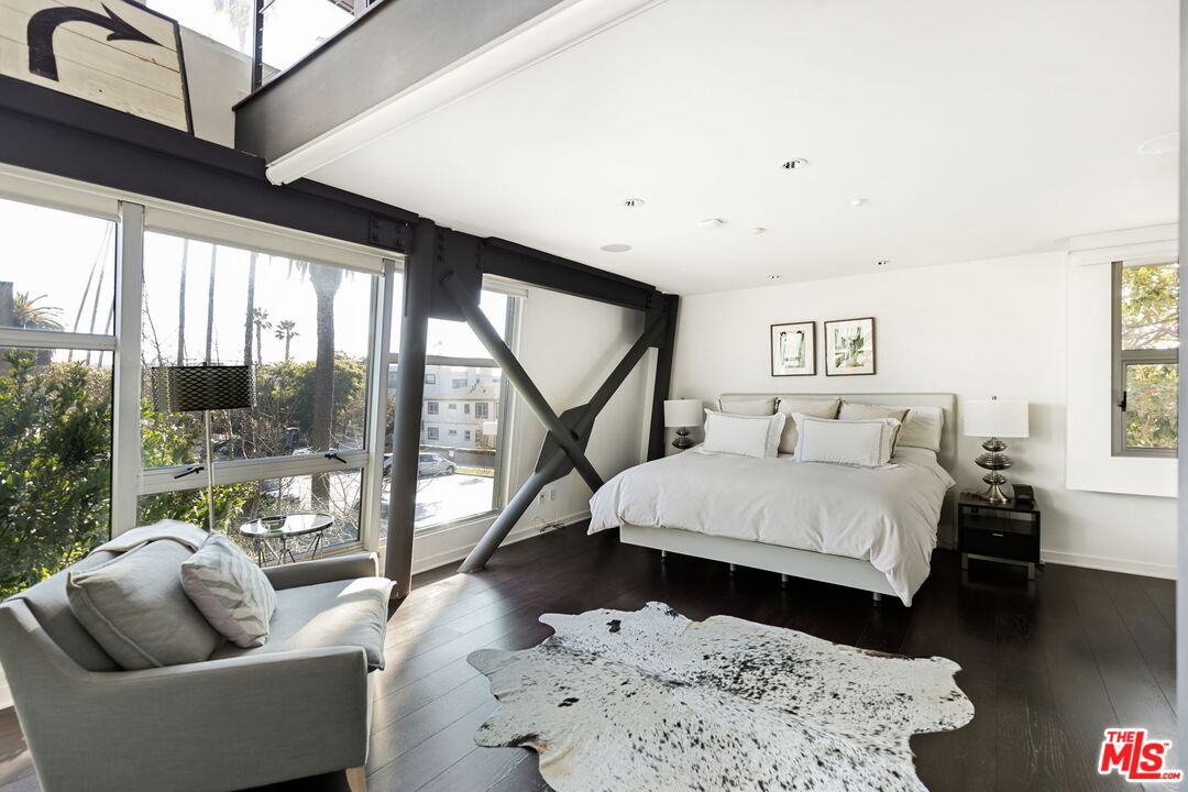 1513 9th Street, Unit 3 Santa Monica, CA 90401 - Photo 15 of 29 a bedroom with a bed and a couch