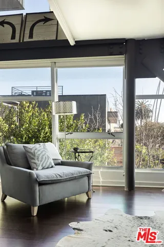 a living room with couch and a window