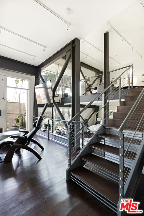 1513 9th Street, Unit 3 Santa Monica, CA 90401 - Photo 22 of 29 a view of staircase with two gym equipment