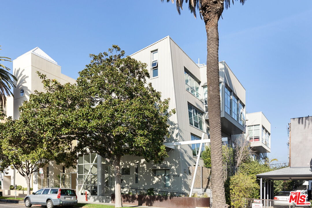 1513 9th Street, Unit 3 Santa Monica, CA 90401 - Photo 26 of 29 a front view of a building with trees