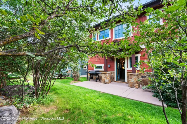 a view of a chairs and table in a yard