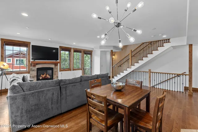 a living room with furniture fireplace and flat screen tv