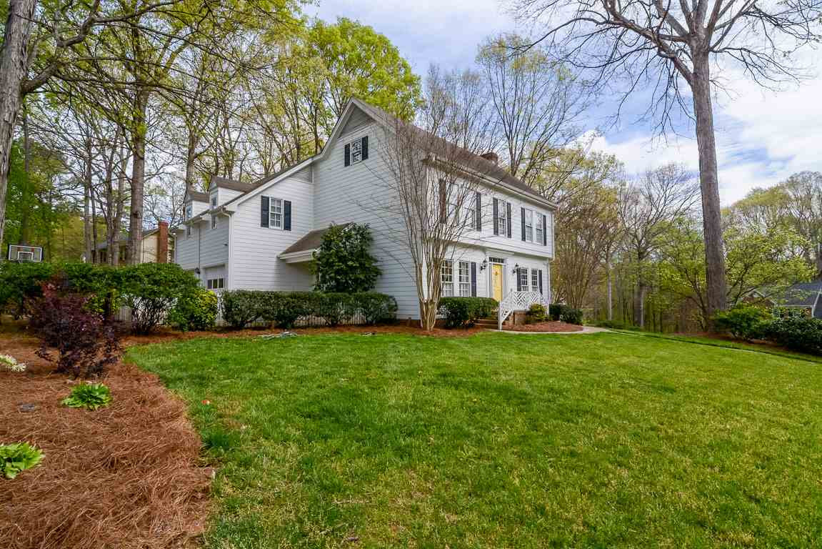 Generous .4 acre corner lot with lush landscaping and privacy. Side-Entry 2-Car Garage