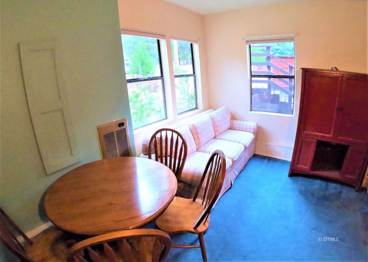 25125 Lodge Road Idyllwild, CA 92549 - Photo 22 of 26 a bedroom with furniture and wooden floor