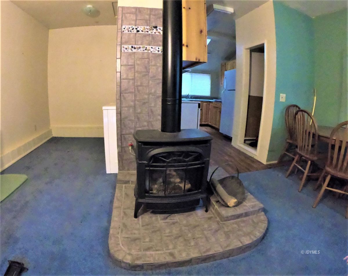 25125 Lodge Road Idyllwild, CA 92549 - Photo 23 of 26 a living room with furniture and a fireplace