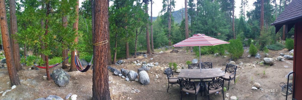 25125 Lodge Road Idyllwild, CA 92549 - Photo 26 of 26 a backyard of a house with a table and chairs