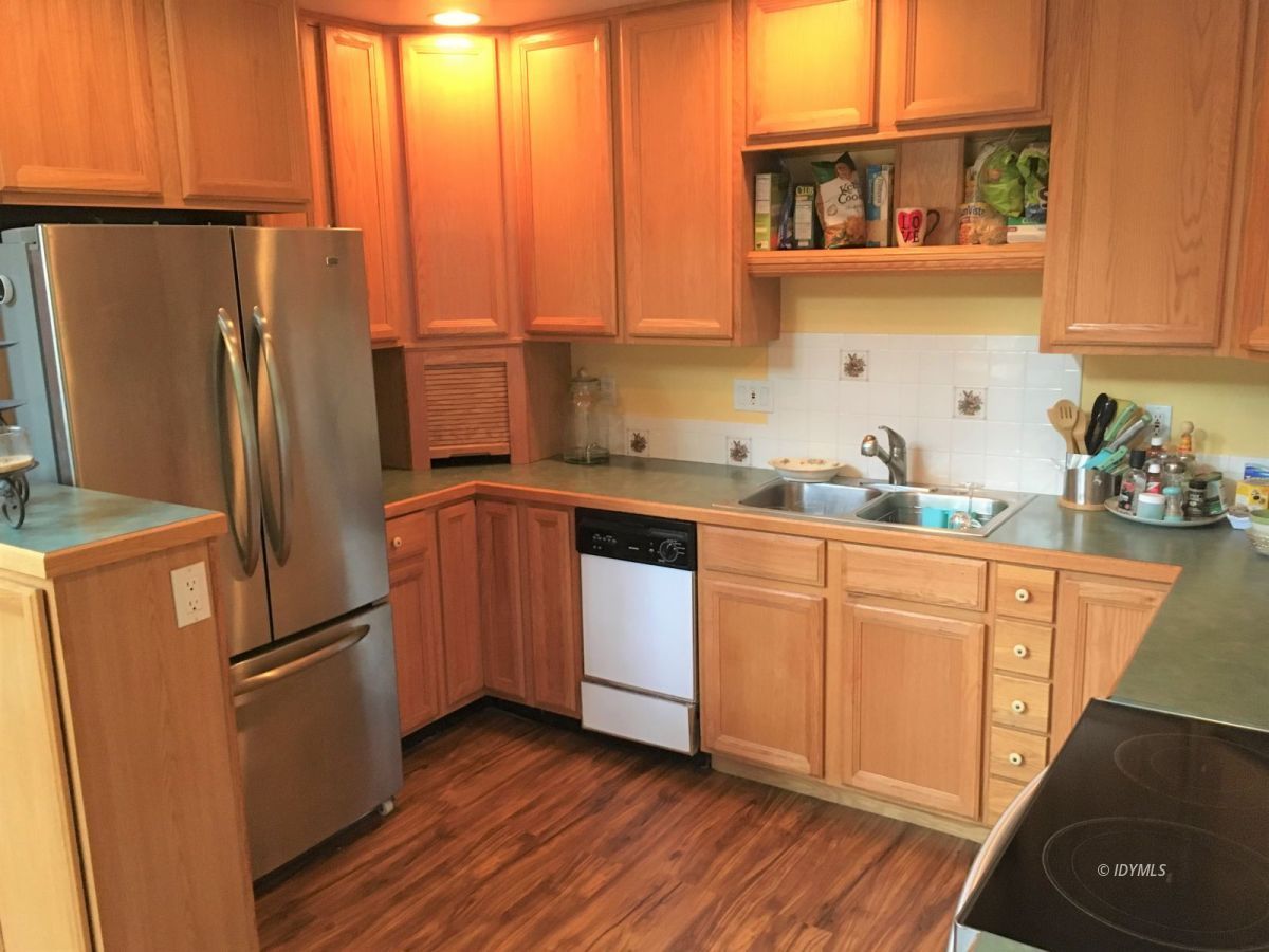 25125 Lodge Road Idyllwild, CA 92549 - Photo 3 of 26 a kitchen with stainless steel appliances a refrigerator sink and microwave