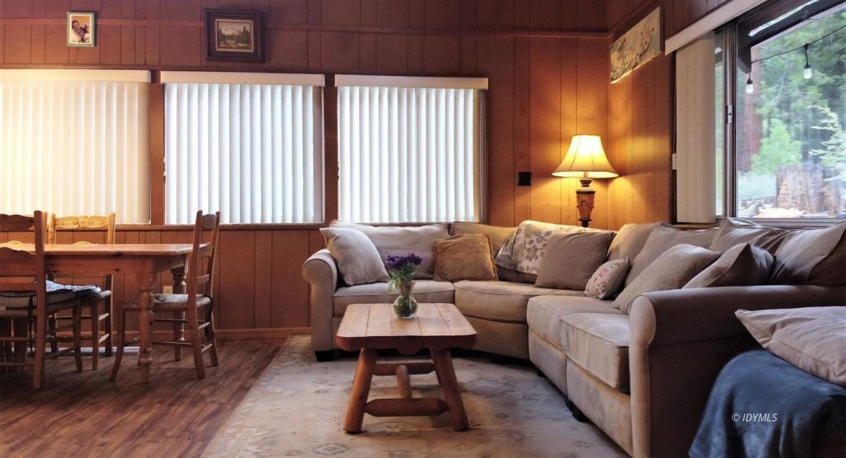 25125 Lodge Road Idyllwild, CA 92549 - Photo 6 of 26 a living room with furniture a lamp and a large window