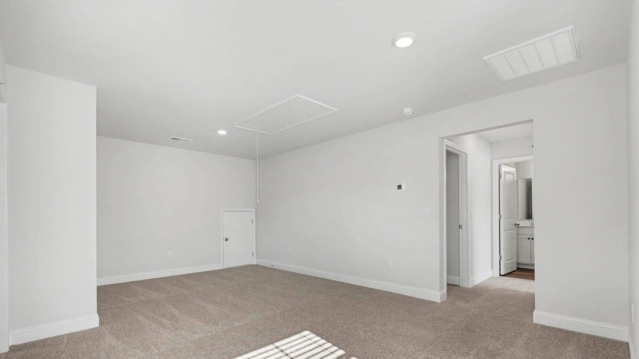 184 Bjorn Way Loris, SC 29569 - Photo 18 of 32 Unfurnished room featuring light colored carpet, recessed lighting, and attic access