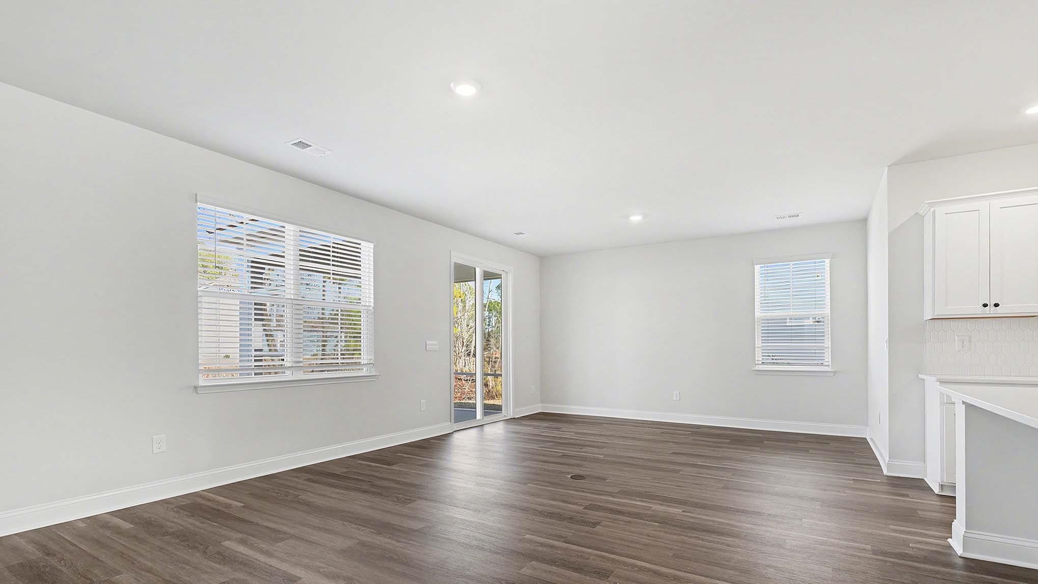 184 Bjorn Way Loris, SC 29569 - Photo 5 of 32 Unfurnished living room featuring plenty of natural light, dark wood-style flooring, and recessed lighting