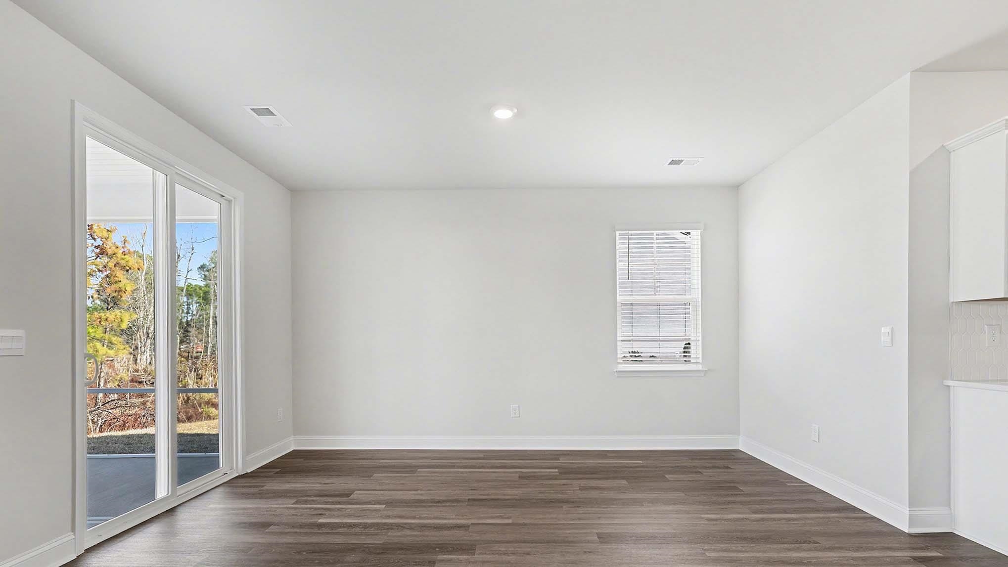 184 Bjorn Way Loris, SC 29569 - Photo 6 of 32 Spare room featuring dark wood-style floors, healthy amount of natural light, and recessed lighting