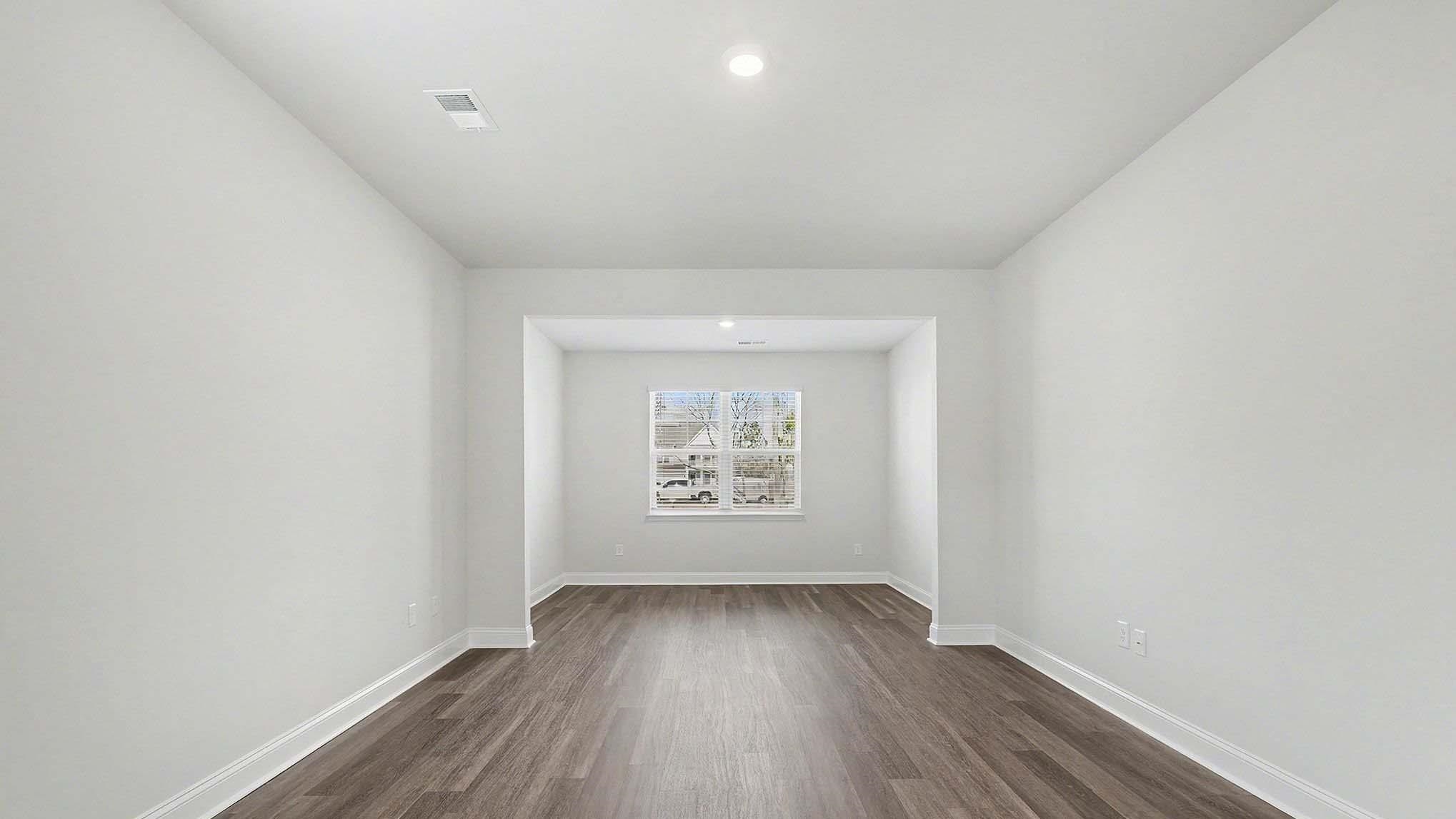 184 Bjorn Way Loris, SC 29569 - Photo 9 of 32 Spare room with dark wood-style flooring and recessed lighting