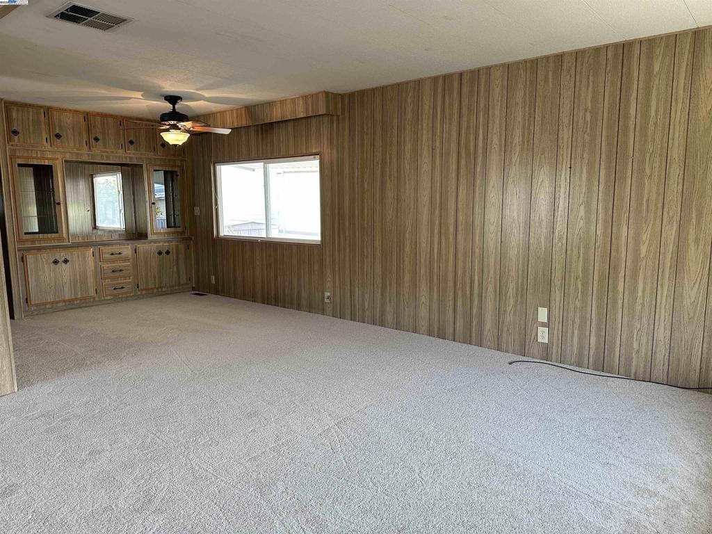 711 Old Canyon Road Fremont, CA 94538 - Photo 11 of 39 a view of an empty room with window and cabinet