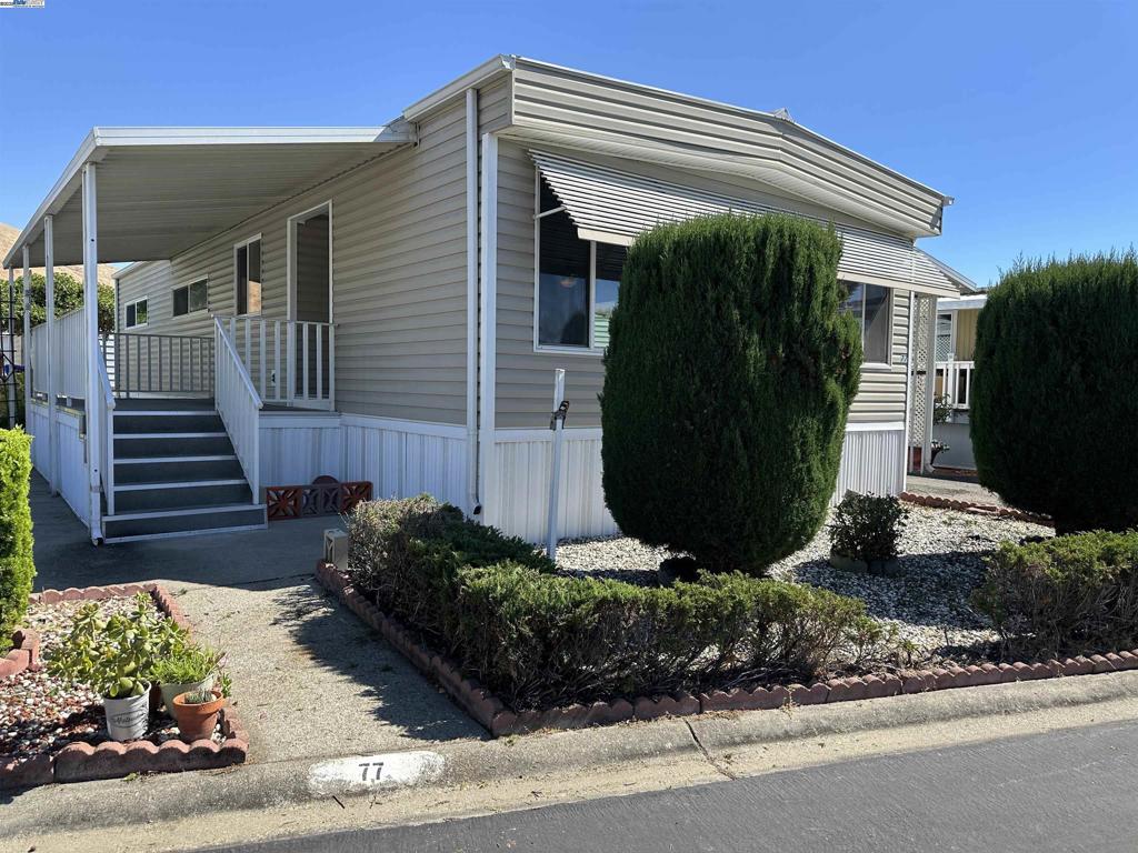 711 Old Canyon Road Fremont, CA 94538 - Photo 5 of 39 a view of a house with a yard