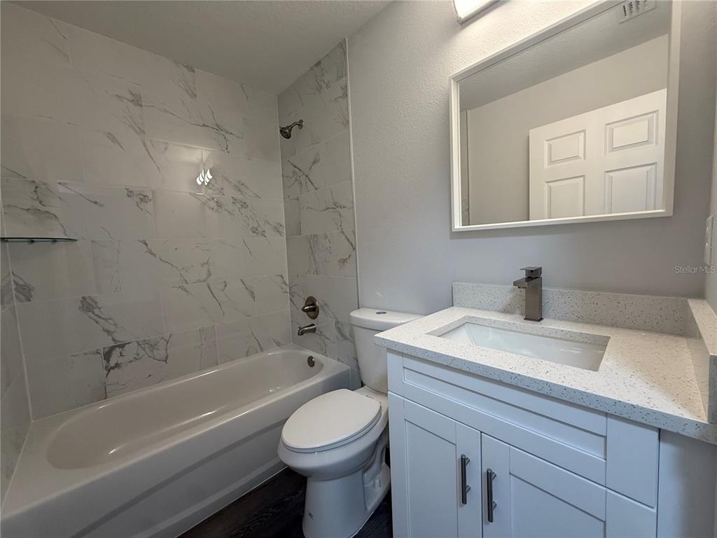 15424 Southwest 27th Lane Ocala, FL 34481 - Photo 11 of 21 a bathroom with a sink a toilet and shower