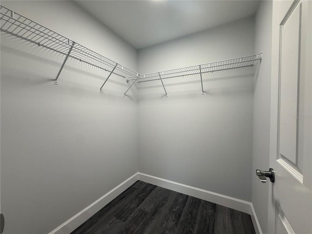 15424 Southwest 27th Lane Ocala, FL 34481 - Photo 19 of 21 a view of a room with racks on the wall