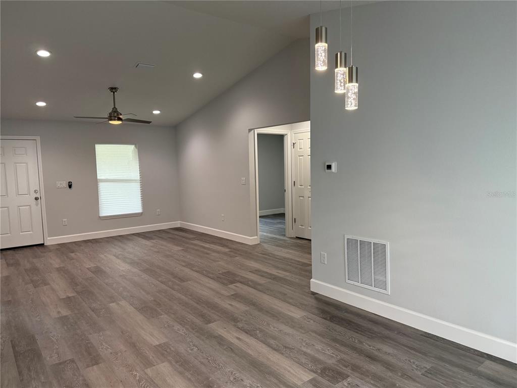 15424 Southwest 27th Lane Ocala, FL 34481 - Photo 21 of 21 an empty room with wooden floor and windows