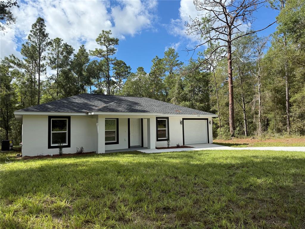 15424 Southwest 27th Lane Ocala, FL 34481 - Photo 3 of 21 a house with garden in front of it