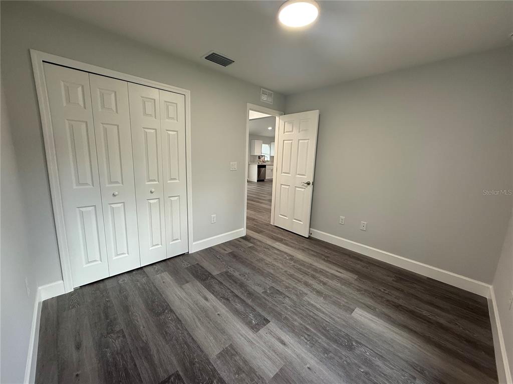15424 Southwest 27th Lane Ocala, FL 34481 - Photo 9 of 21 a view of an empty room with wooden floor