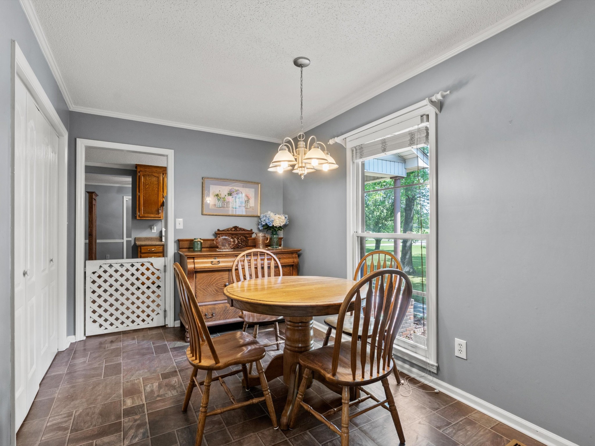 6934 Old Railroad Bed Road Toney, AL 35773 - Photo 13 of 38 a dining room with furniture a chandelier and wooden floor