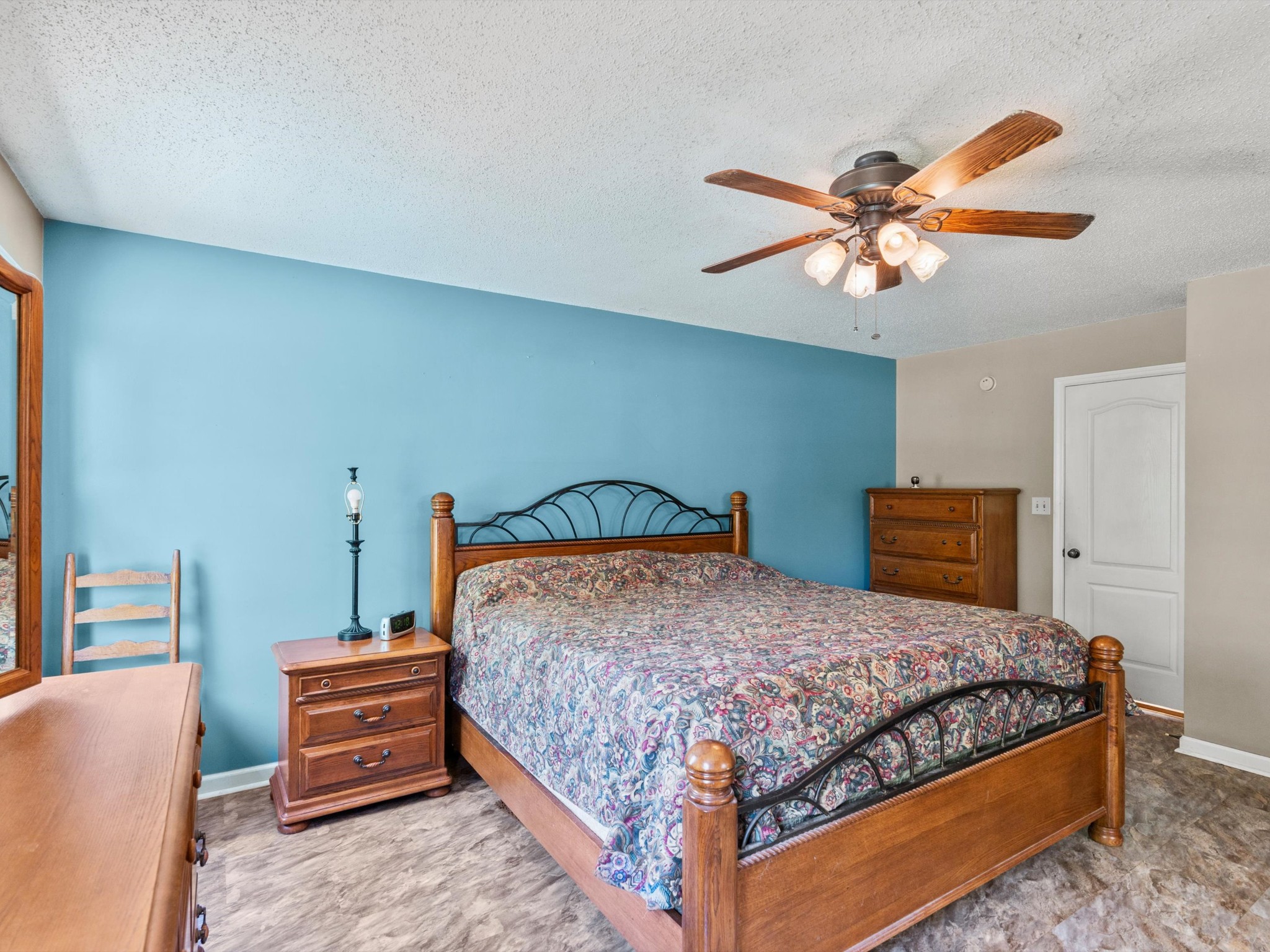 6934 Old Railroad Bed Road Toney, AL 35773 - Photo 15 of 38 a bedroom with a bed and a chandelier
