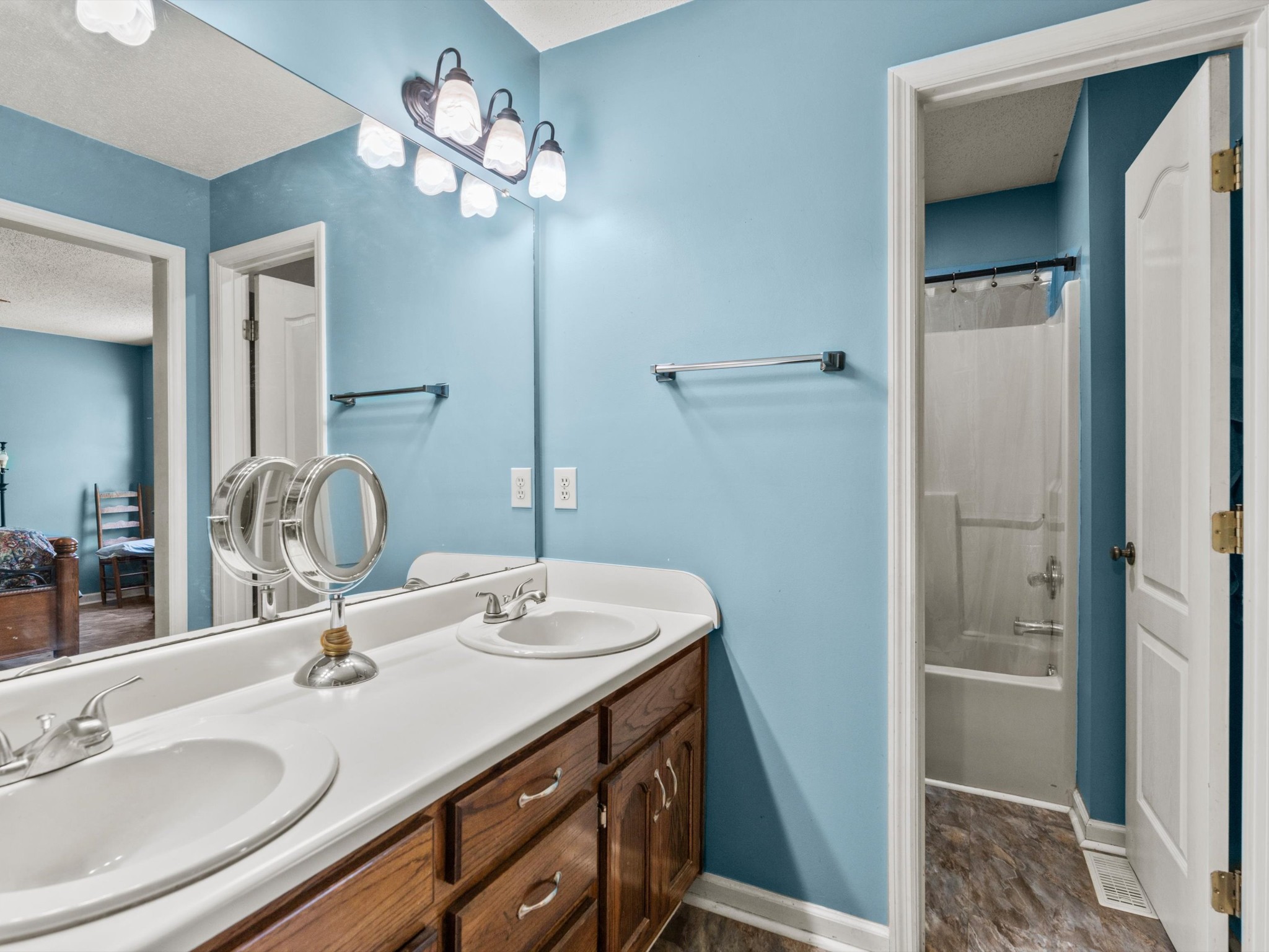 6934 Old Railroad Bed Road Toney, AL 35773 - Photo 18 of 38 a bathroom with a double vanity sink a and a mirror
