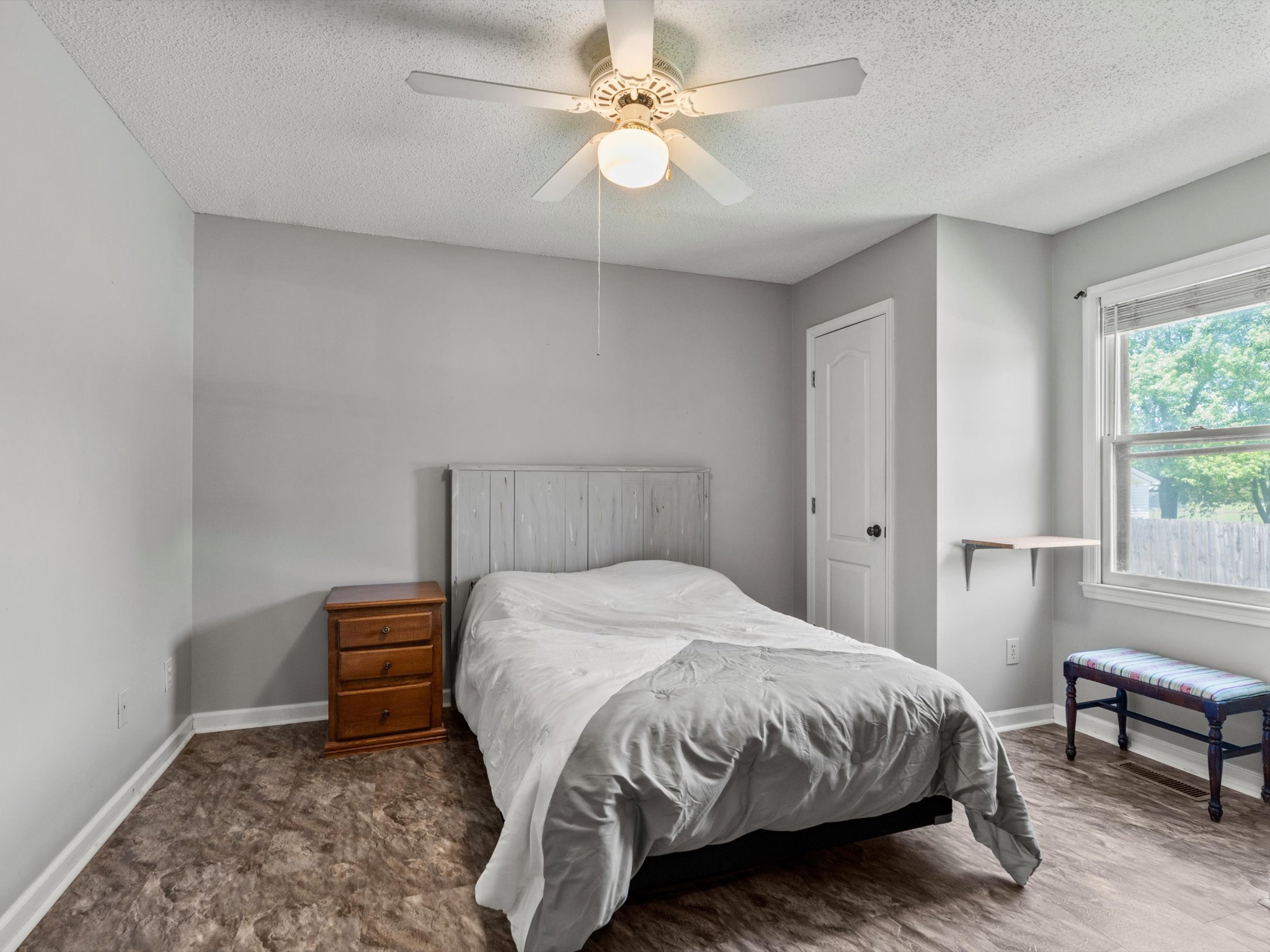 6934 Old Railroad Bed Road Toney, AL 35773 - Photo 22 of 38 a bedroom with a bed and a chandelier