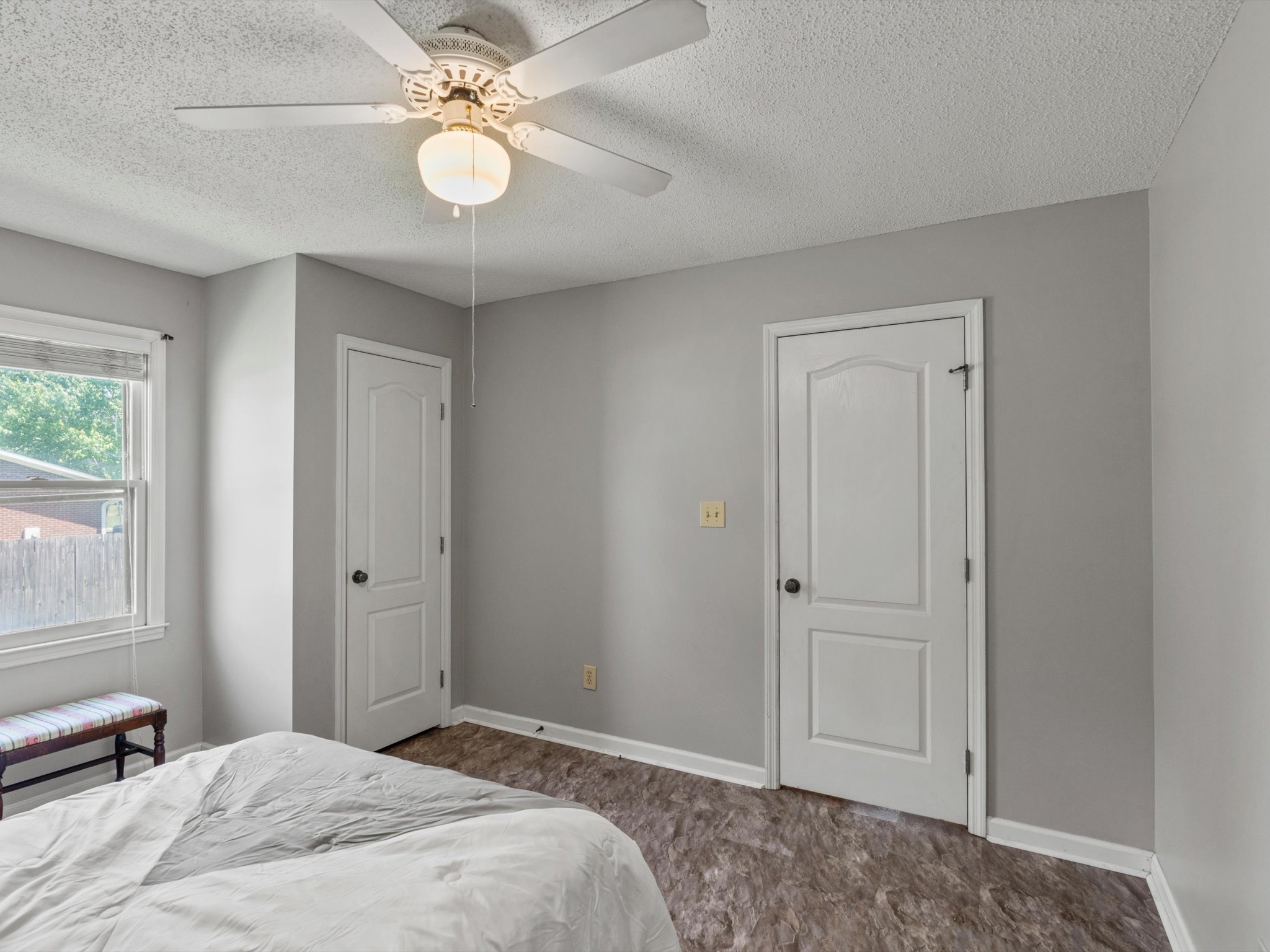 6934 Old Railroad Bed Road Toney, AL 35773 - Photo 23 of 38 a bedroom with a bed and a chandelier