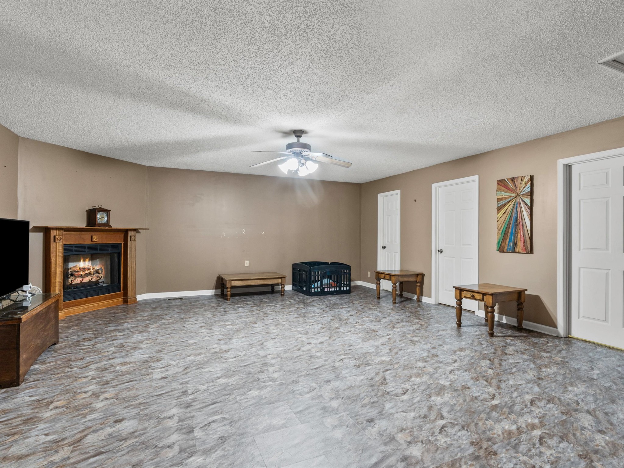 6934 Old Railroad Bed Road Toney, AL 35773 - Photo 24 of 38 a view of a livingroom with furniture and a ceiling fan