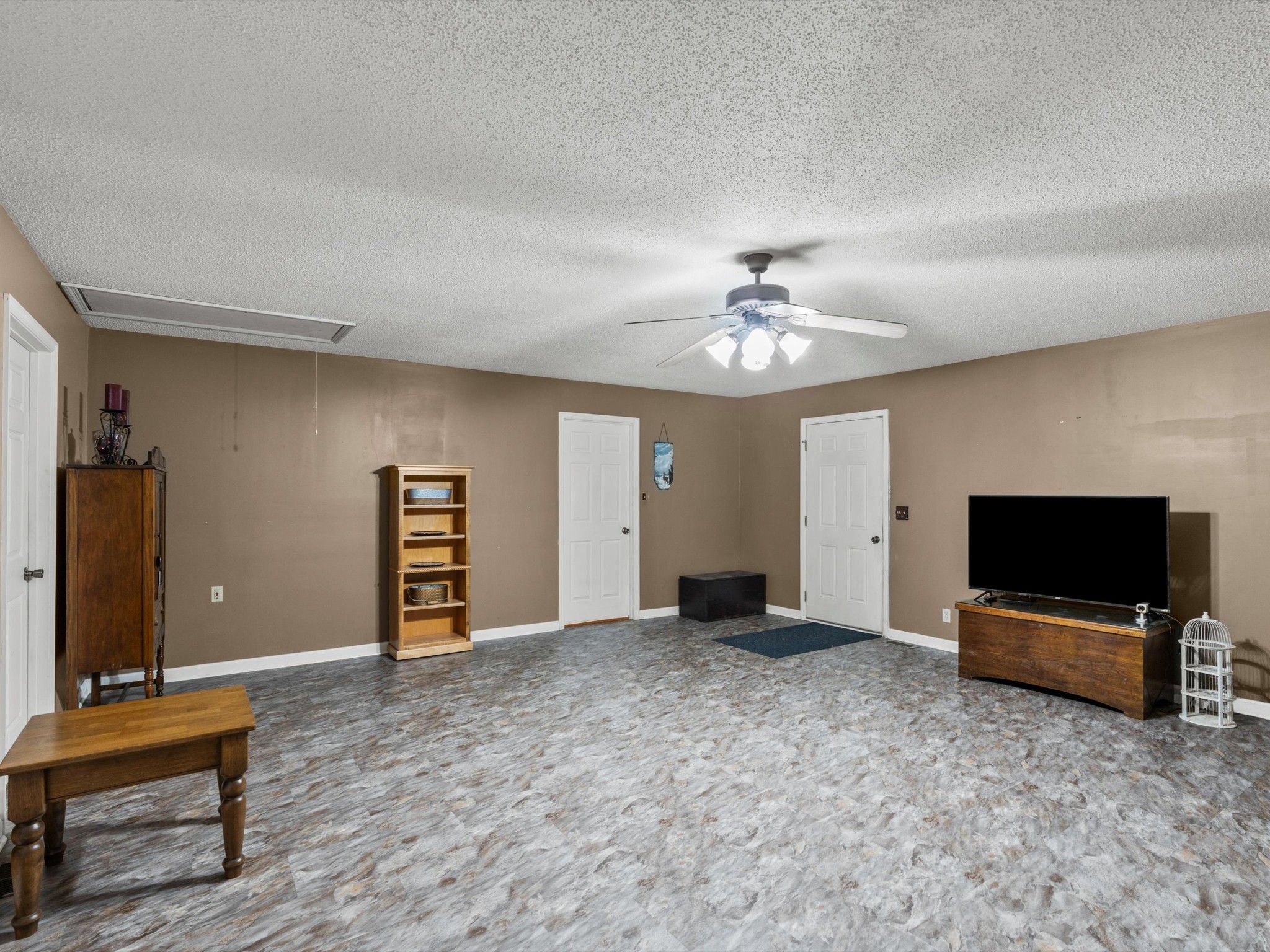 6934 Old Railroad Bed Road Toney, AL 35773 - Photo 25 of 38 a view of a livingroom with a flat screen tv and fireplace