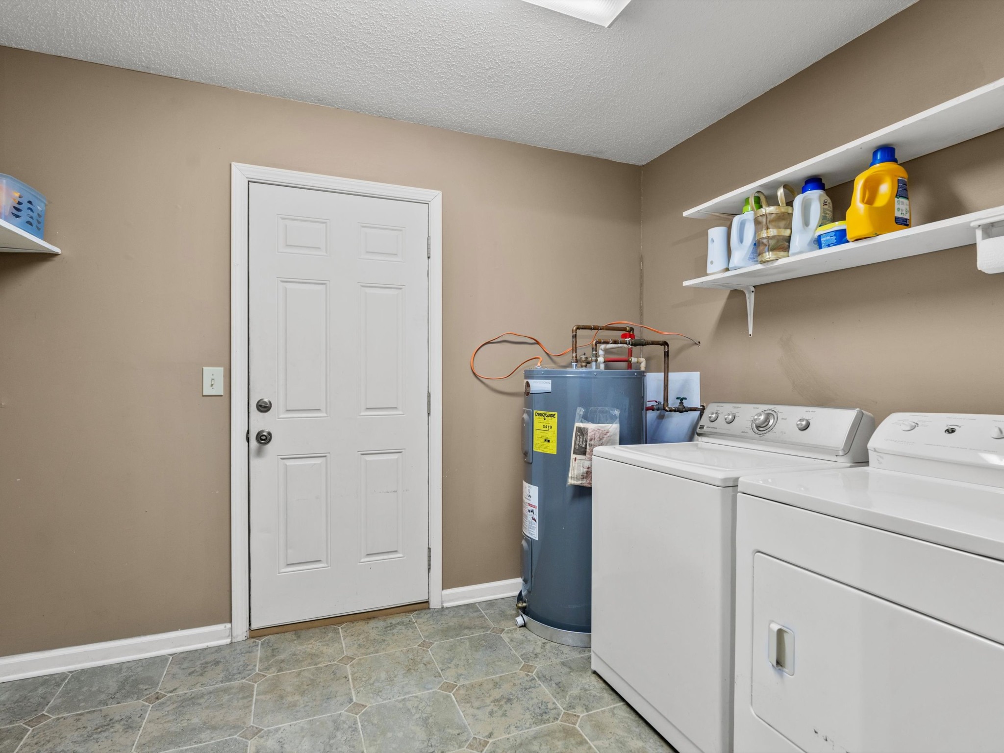6934 Old Railroad Bed Road Toney, AL 35773 - Photo 28 of 38 a view of storage and utility room with washer and dryer
