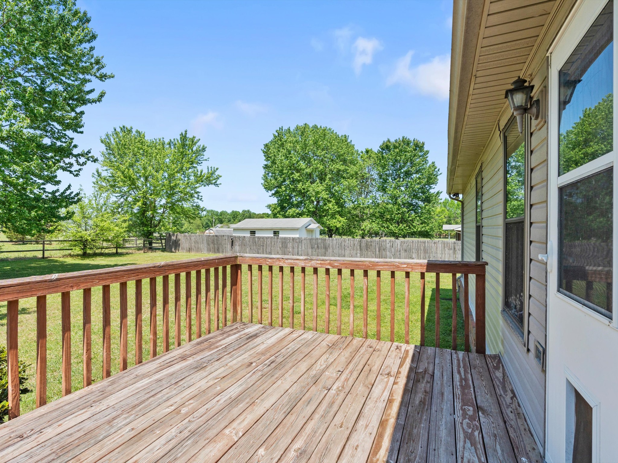 6934 Old Railroad Bed Road Toney, AL 35773 - Photo 35 of 38 a balcony with wooden floor and fence