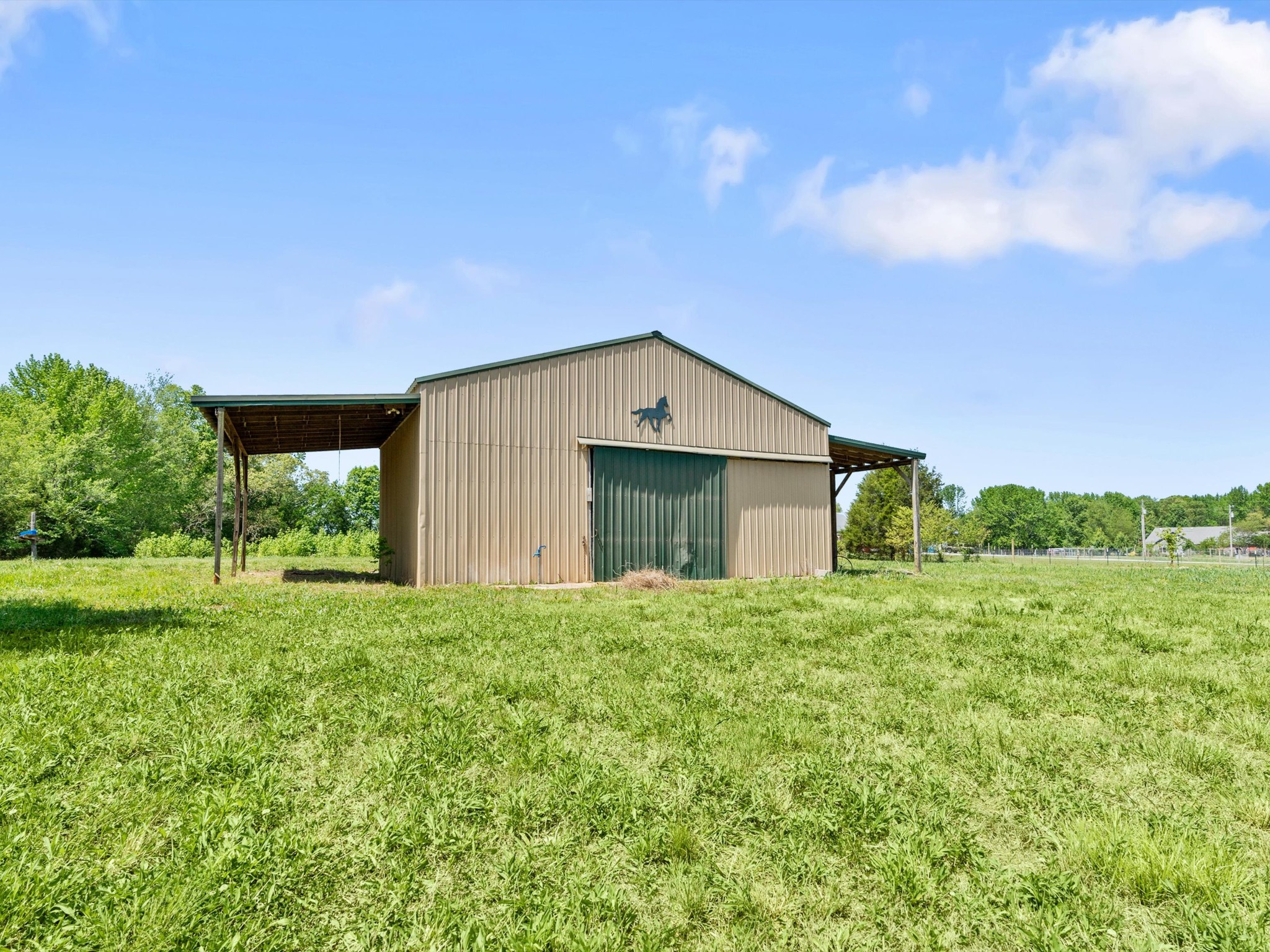 6934 Old Railroad Bed Road Toney, AL 35773 - Photo 37 of 38 a house with huge green field in front of it
