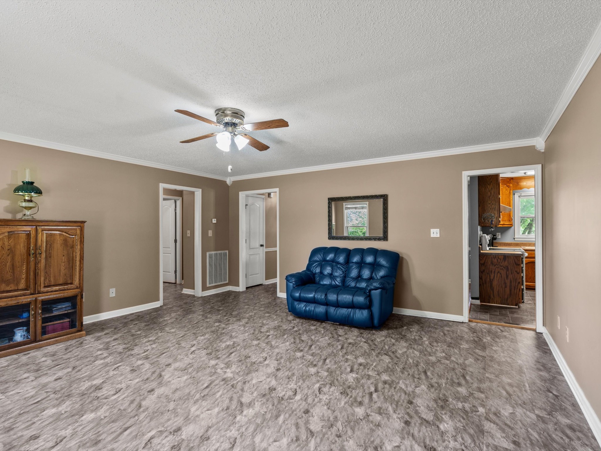 6934 Old Railroad Bed Road Toney, AL 35773 - Photo 5 of 38 a living room with furniture a ceiling fan and a window