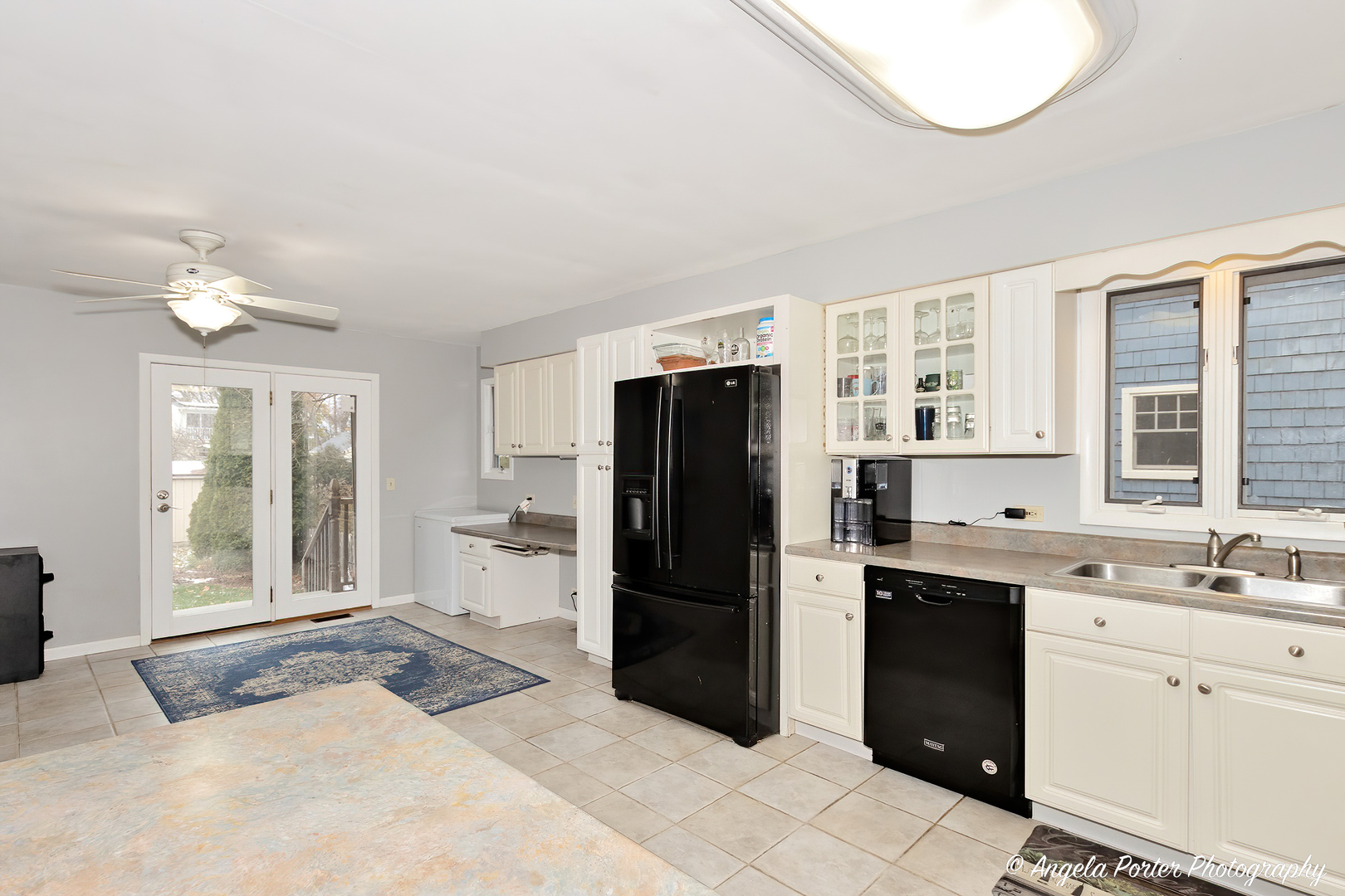 238 Harding Street Grayslake, IL 60030 - Photo 9 of 21 a kitchen with a refrigerator sink and cabinets